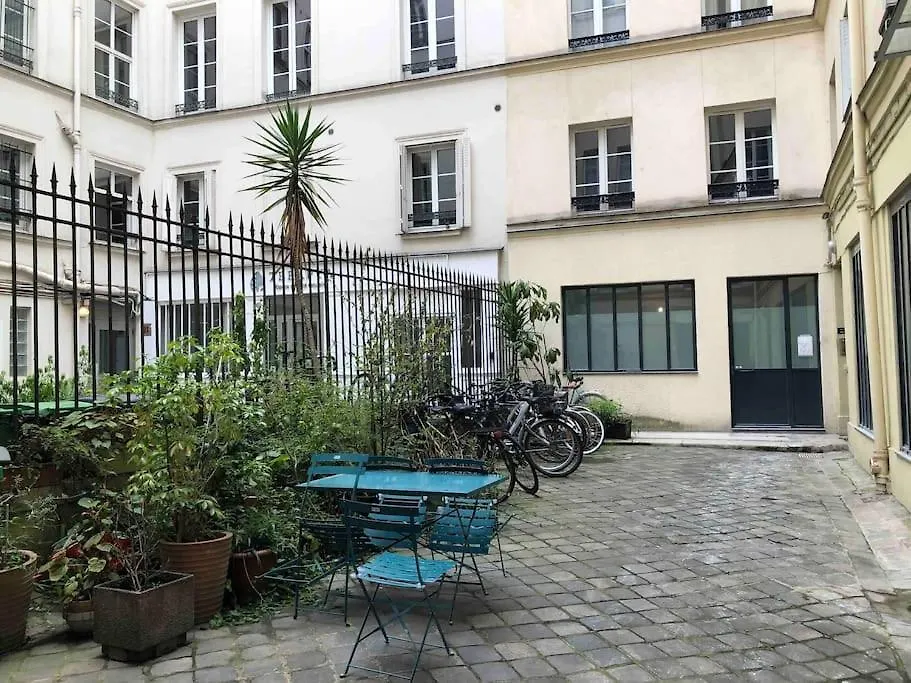 Charming Parisian Under The Rooftops